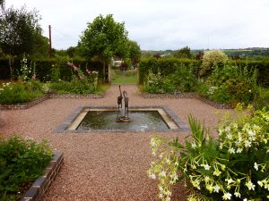 ornamental garden - water feature with storks